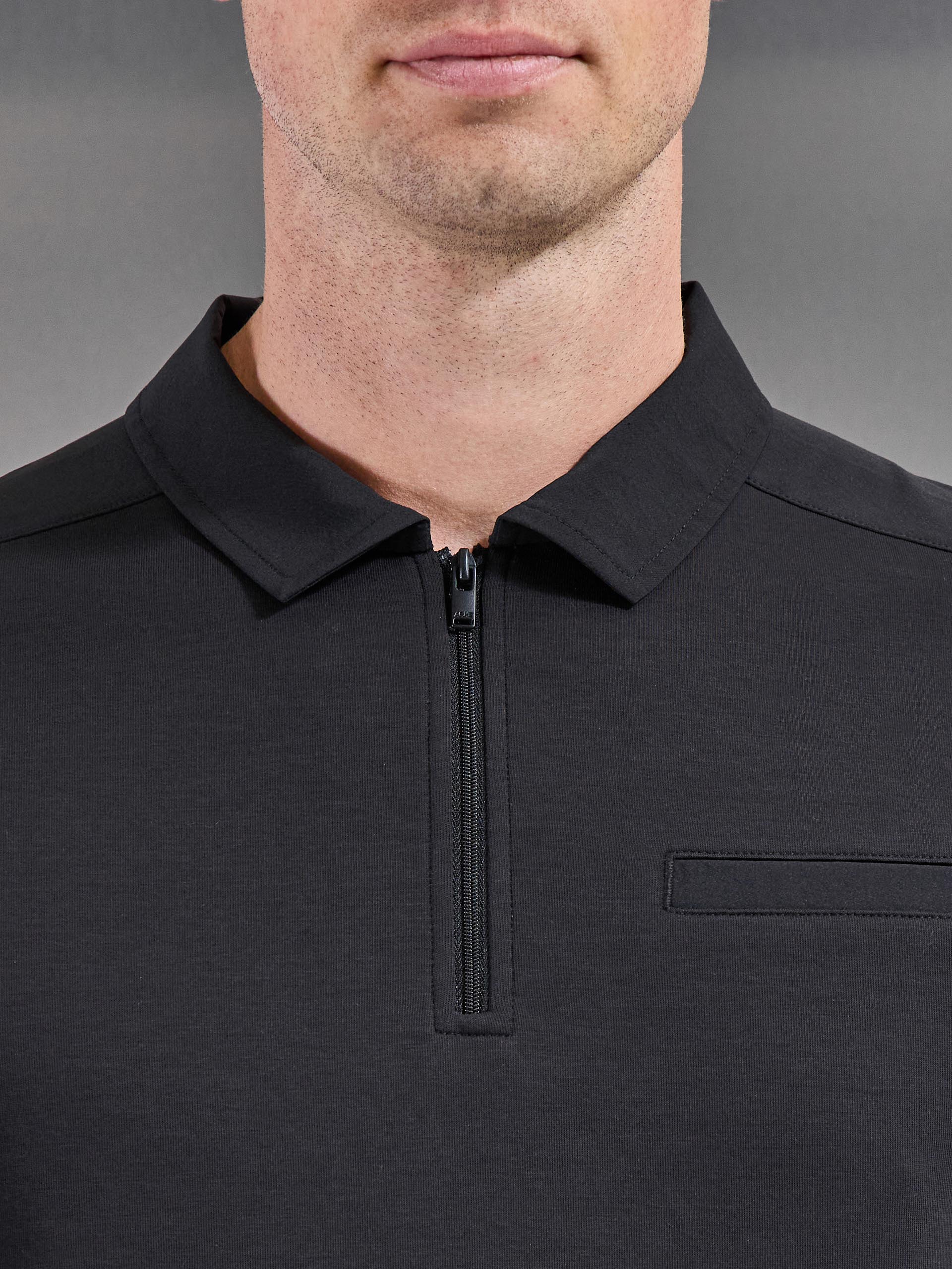 Hybrid Cargo Zip Polo Shirt in Black - Image 3